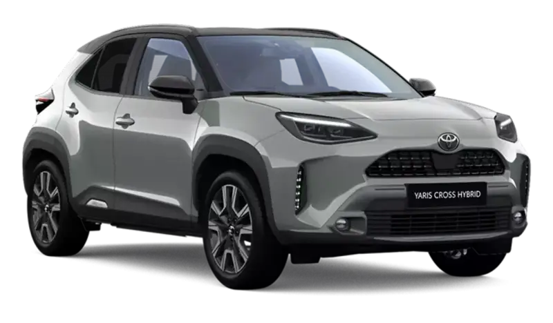 Srebrny Toyota Yaris Cross Hybrid z czarnym dachem, prezentujący nowoczesny design i hybrydowy napęd.