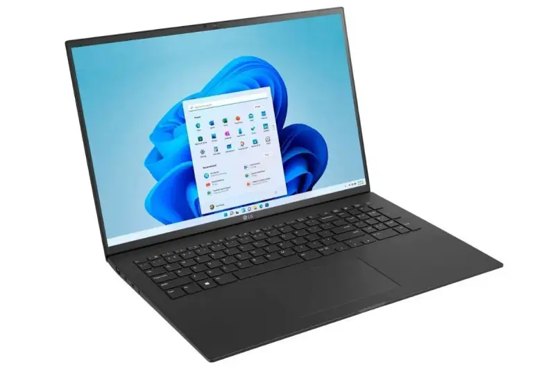 Czarny laptop LG z ekranem wyświetlającym menu startowe Windows 11. Czy warto zainwestować w ten system?