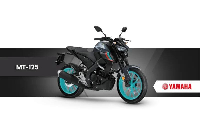 Szary motocykl Yamaha MT-125 z turkusowymi felgami, gotowy na miejskie przygody.