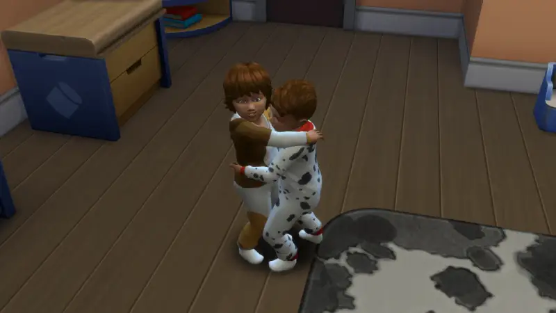 Dzieci w piżamkach przytulają się. W The Sims 4, aby zrobić dziecko, potrzebujesz dorosłych Simów i łóżka.