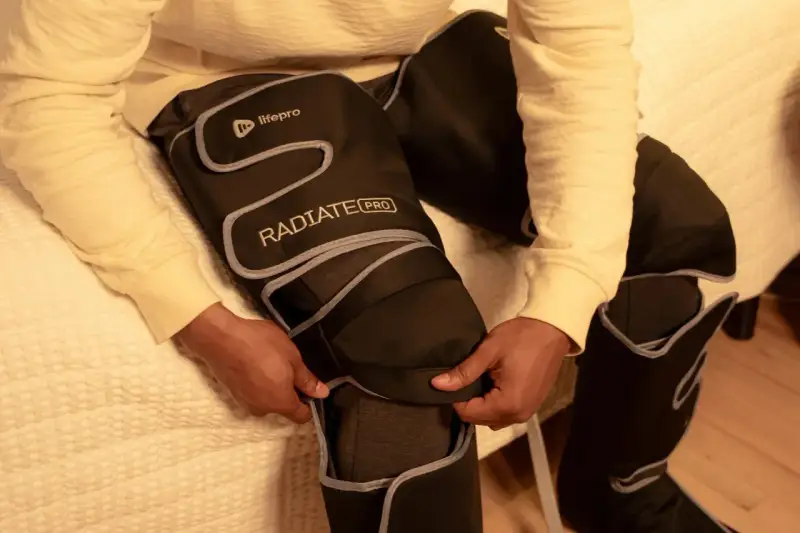 Person zips up leg compression machine. Consult your doctor on how long should you use leg compression machine for best results.