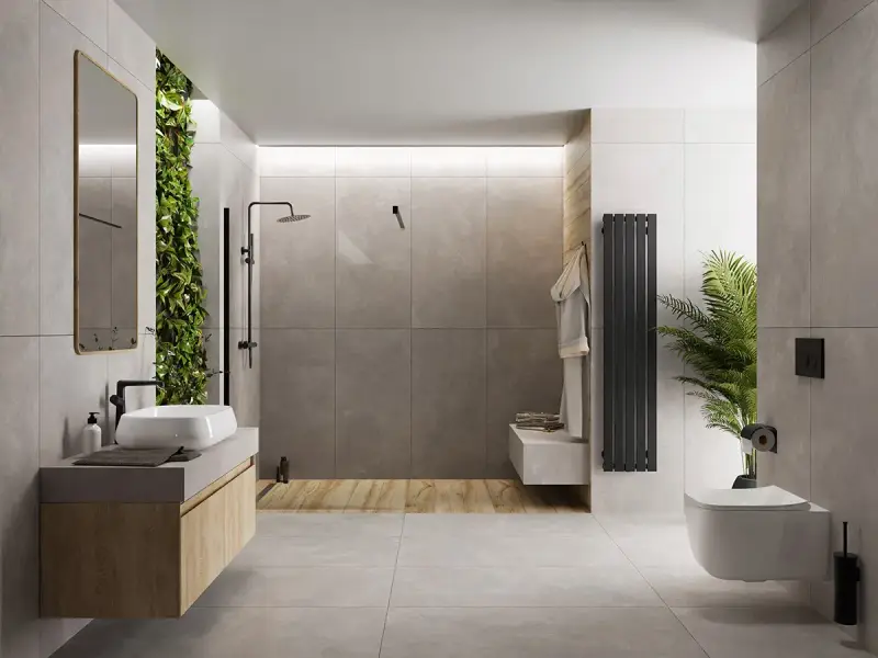 Nowoczesna łazienka z zieloną ścianą i betonem architektonicznym. Mikrocement na płytki nadaje jej surowego, ale eleganckiego charakteru.