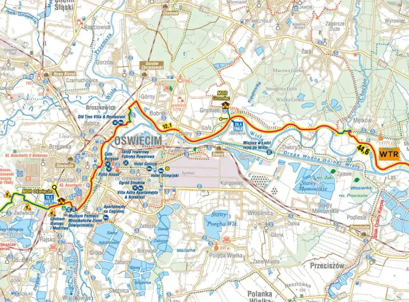 Trasy rowerowe Małopolska: mapa okolic Oświęcimia z zaznaczonymi szlakami, atrakcjami i drogami wodnymi Wisły.