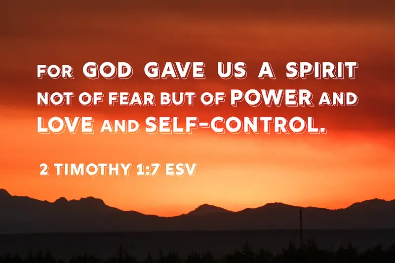 Sunset over mountains with text: "For God gave us a spirit not of fear but of power and love and self-control. 2 Timothy 1:7 ESV.
