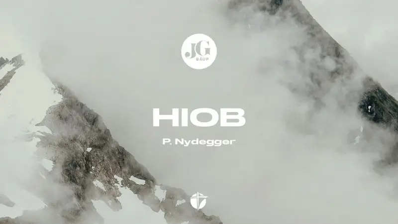 Berglandschaft im Nebel. Der Text "HIOB 38 11" und "P. Nydegger" sind sichtbar.