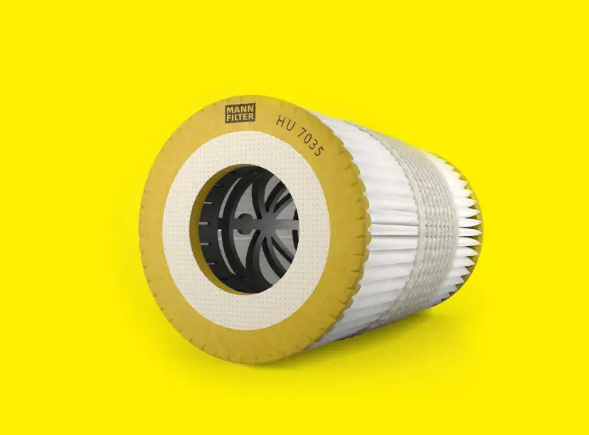Mann Filter Ölfilter-Kartusche HU 7035 auf gelbem Hintergrund.