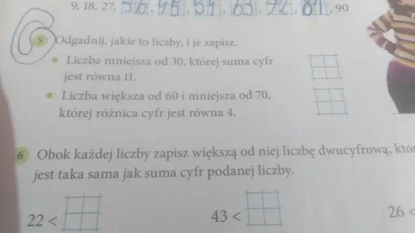 Fragment zeszytu z zadaniami matematycznymi, widoczne liczby i tekst.