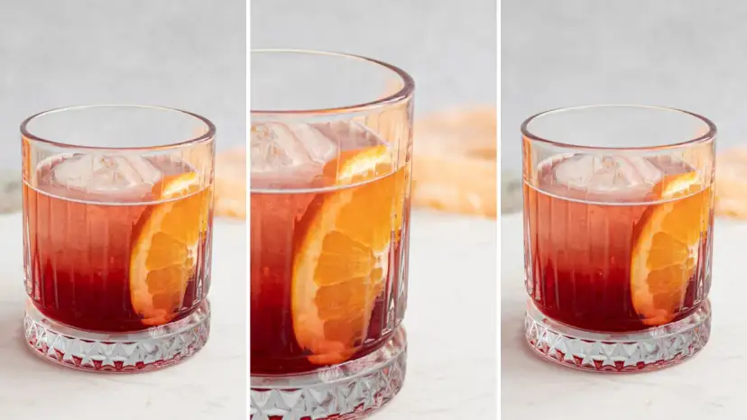 Przepis na Negroni Sbagliato: czerwony koktajl z lodem i plasterkiem pomarańczy w szklance.