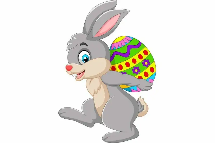 Wesoły zajączek z kolorowym jajkiem na plecach. Czy to dlatego zajączek jest symbolem wielkanocy?
