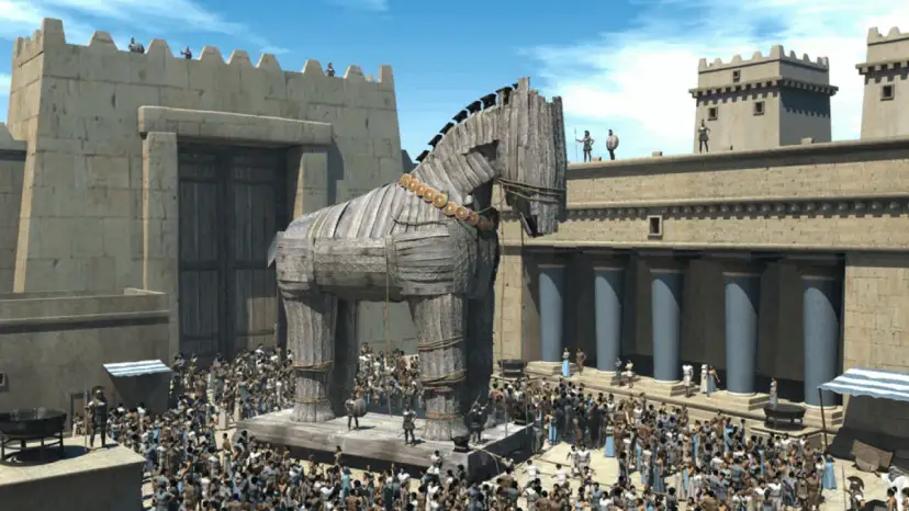 Wielki drewniany koń, symbol mitu o koniu trojańskim, stoi przed bramą miasta. Tłum ludzi obserwuje go z podziwem.