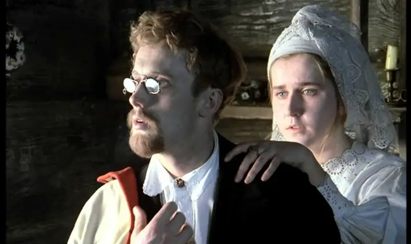 Mężczyzna w okularach i z brodą, przypominający imię Rydla poety, z kobietą w białej chuście.