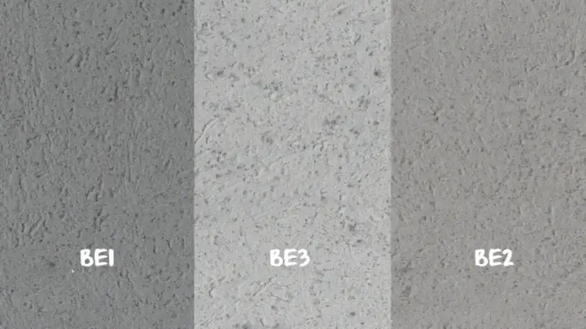 Próbki betonu dekoracyjnego na ścianę: BE1 (ciemniejszy), BE3 (jasny), BE2 (średni). Różne tekstury i odcienie szarości.